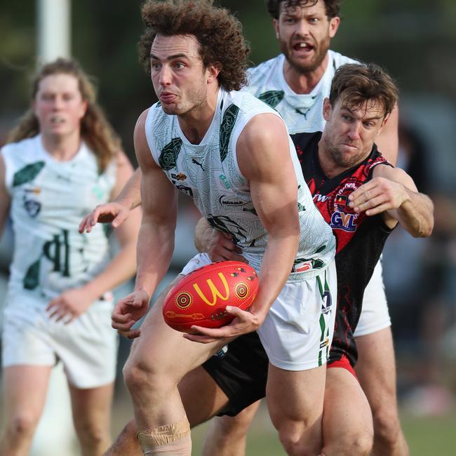 Echuca’s Liam Tenace sets off with the ball against Kyabram.