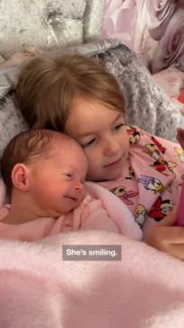 Newborn and her big sister bond over video