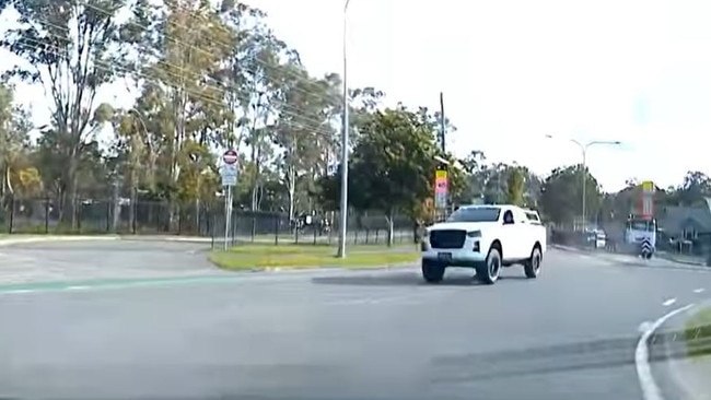 Flashing orange school zone lights are clearly seen behind the ute in the footage. Picture: Monterey Keys Community Group / Facebook.