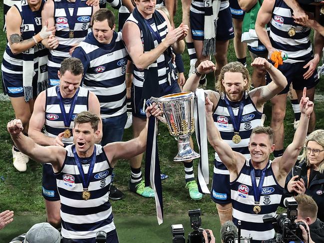 Hawkins and Selwood head to the change room with the Premiership Cup. Picture: David Caird