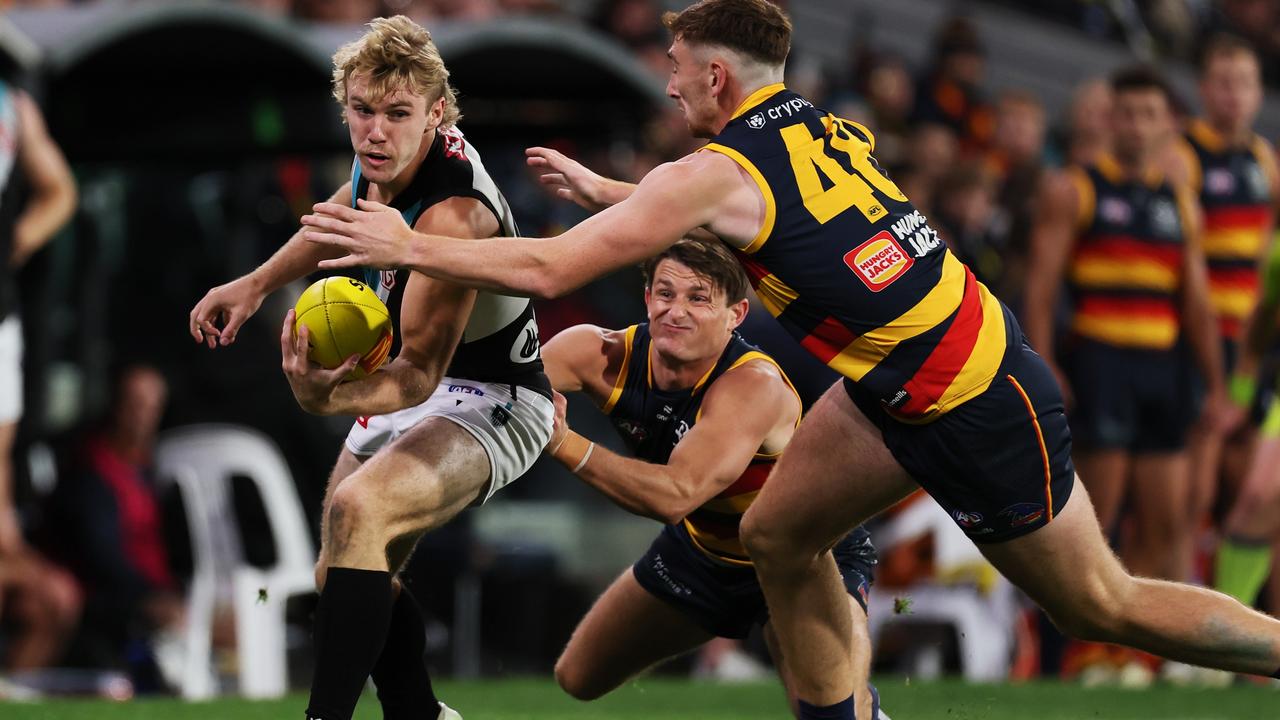 Matt Crouch and Mark Keane hunt down Jason Horne-Francis during the Showdown on Thursday night. Picture: James Elsby/AFL Photos via Getty Images