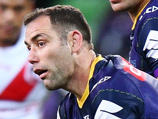 MELBOURNE, AUSTRALIA - JULY 05:  Cameron Smith of the Storm passes the ball over Jeremy Latimore of the Dragons during the round 17 NRL match between the Melbourne Storm and the St George Illawarra Dragons at AAMI Park on July 5, 2018 in Melbourne, Australia.  (Photo by Michael Dodge/Getty Images)