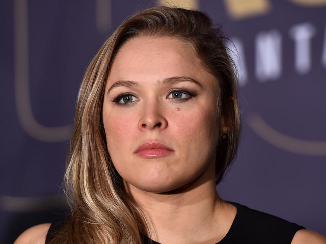 Ronda Rousey speaks to journalists during a media call at Etihad Stadium in Melbourne,  Friday, Nov. 13, 2015. Rousey and Holly Holm will fight for the women's UFC bantam weight title on Sunday. (AAP Image/Julian Smith) NO ARCHIVING