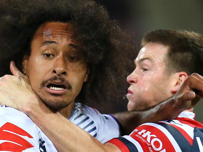 SYDNEY, AUSTRALIA - SEPTEMBER 28:  Felise Kaufusi of the Storm is tackled by Luke Keary of the Roosters during the NRL Preliminary Final match between the Sydney Roosters and the Melbourne Storm at the Sydney Cricket Ground on September 28, 2019 in Sydney, Australia. (Photo by Jason McCawley/Getty Images)