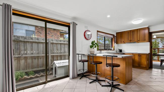 Timber cabinetry is a feature in the kitchen.