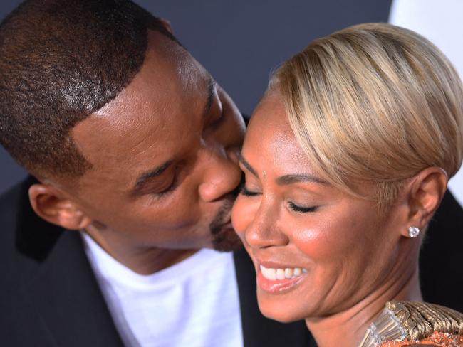 (FILES) US actor Will Smith (L) kisses actress Jada Pinkett Smith as they arrive for the premiere of "Gemini Man" at the TCL Chinese Theatre in Hollywood, California on October 6, 2019. Pinkett Smith has been separated from husband Smith since 2016 -- six years before the infamous "Oscars Slap" -- she revealed in an interview that aired on October 11, 2023. The pair had already been living "totally separate lives" for years before the notorious incident, Pinkett Smith told NBC News. (Photo by VALERIE MACON / AFP)