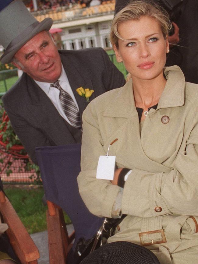 Clive James tries his best to catch the attention of supermodel Daniela Prestova at the 1995 Melbourne Cup.