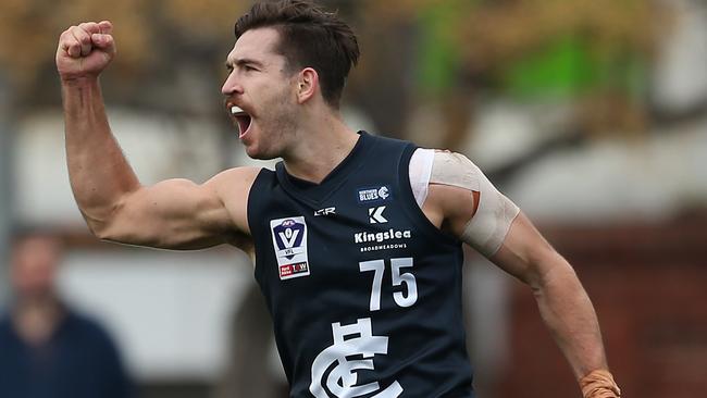 Frank Anderson celebrates a goal for the Northern Blues in the VFL.