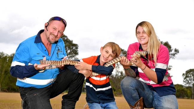 Tony Harrison, Jensen Harrison age 8 and Brooke Harrison with a Black Headed Python. Picture, John Gass