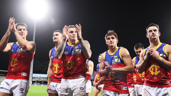 Mitch Robinson and teammates celebrate their latest win. Picture: AFL Photos/via Getty Images