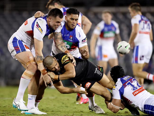 Josh Mansour of the Panthers offloads the ball during the round three NRL match against the Knights. Picture: Mark Kolbe/Getty Images