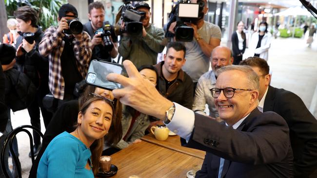 Anthony Albanese poses for a selfie at Sydney cafe with Labor candidate Jerome Laxale and constituents hours before he tested postive for Covid. Picture: Toby Zerna