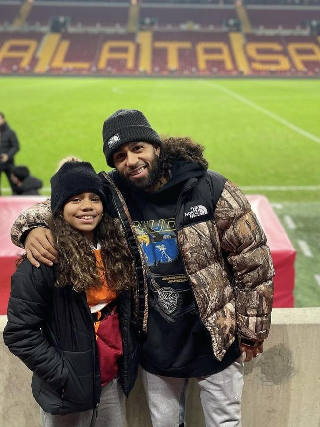 Jordon Crawford, pictured with teenage daughter Alaynah, at a professional football match in Turkey. Picture: Jordon Crawford/Instagram