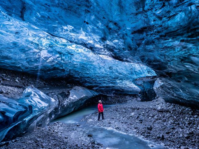 ONE TIME WEB USE FOR NEWS.COM.AU ONLY - FEES APPLY - MUST DOWNLOAD ON OWN ACCOUNT -  2PG4M0E Explorer inside Sapphire Breioamerkurjokull Ice Cave of the Vatnajokull National Park, Iceland  Picture: Alamy