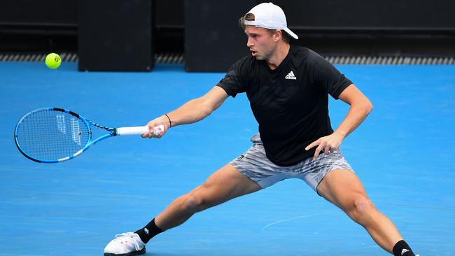 Alexandre Muller returns a forehand against Kyrgios. Picture: William West/AFP