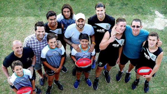 Port Adelaide's father/son academy training in 2018. George Fiacchi with son Zane, Gavin Wanganeen and son Tex, Peter Burgoynewith sons Trent, Jase and Rome, Director Stuart Cochrane, Darren Mead with sons Jackson and Mitch. Picture: DYLAN COKER.