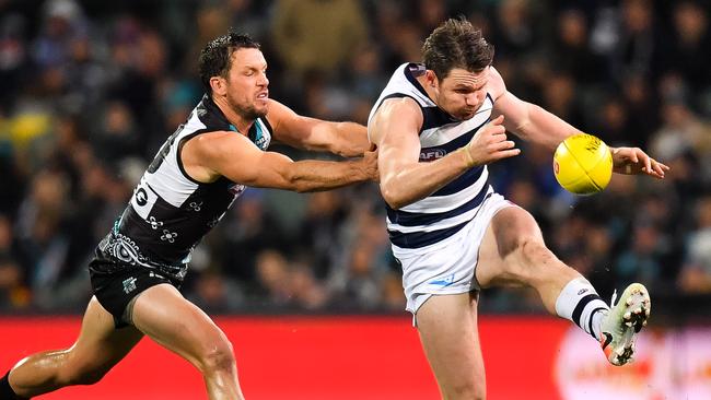 Patrick Dangerfield is put under pressure from Travis Boak. Picture: Getty Images