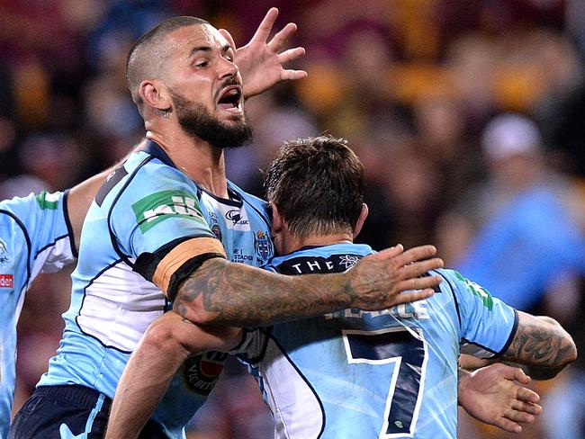 Nathan Peats celebrates with Mitchell Pearce.