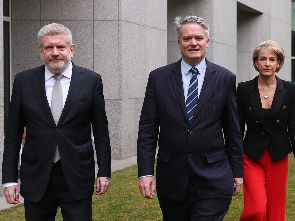 Mitch Fifield, Mathias Cormann and Michealia Cash holding a press conference at Parliament House in Canberra.