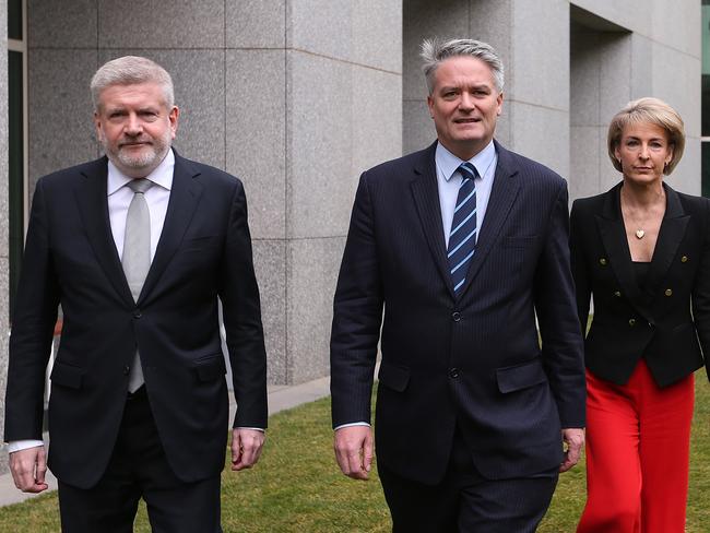 Mitch Fifield, Mathias Cormann and Michealia Cash holding a press conference at Parliament House in Canberra.