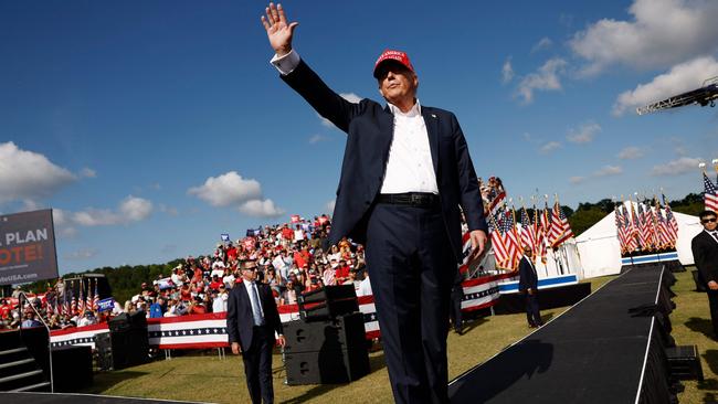 Republican presidential candidate, former U.S. President Donald Trump walks offstage after giving remarks at a rally. Picture: AFP