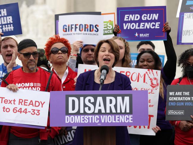 WASHINGTON, DC - NOVEMBER 07: U.S. Sen. Amy Klobuchar (D-MN) speaks as activists gather outside U.S. Supreme Court for a gun-control rally on November 7, 2023 in Washington, DC. The Supreme Court is scheduled to hear argument today for a case about whether domestic violence offenders are protected by the Second Amendment to own guns.   Alex Wong/Getty Images/AFP (Photo by ALEX WONG / GETTY IMAGES NORTH AMERICA / Getty Images via AFP)