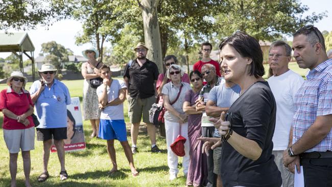 Labor candidate for strathfield Jodi McKay and Burwood mayor John Faker talk to residents across the road from Flower Power. Picture: Damian Shaw