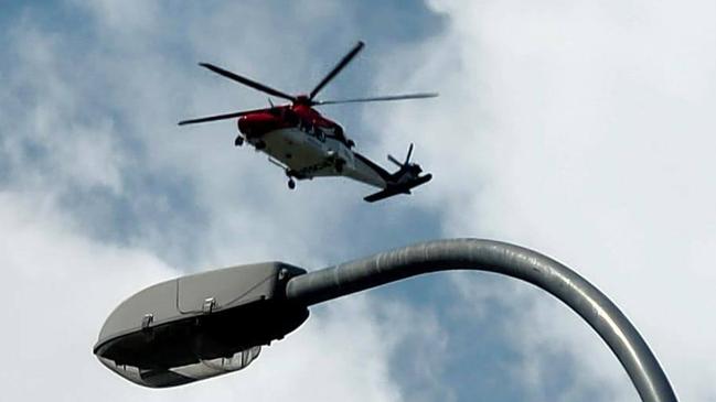 Rescue 510 helicopter flying over Cairns' southern suburbs.