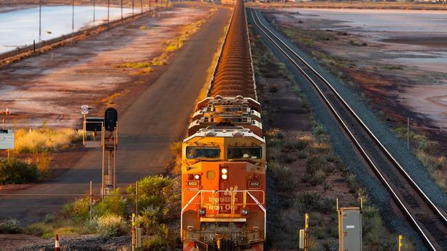 A BHP freight train carrying Australian iron ore to port. PHOTO: IAN WALDIE/BLOOMBERG NEWS