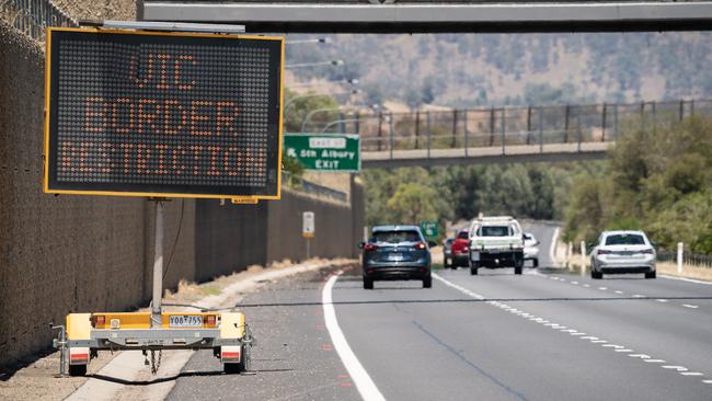 . A sign on the Hume Freeway in Albury near the NSW VIC border warning people of the new permits to enter into Victoria. Picture: Simon Dallinger