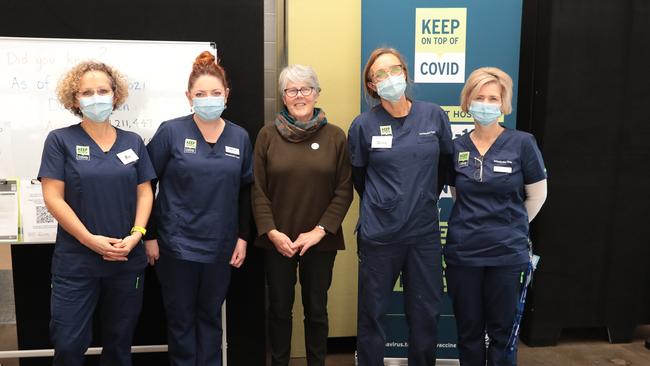 Nurses at the Kingston vaccination centre, with Janet Potter, who just had her second shot of AstraZeneca. (LTR) Bec Osborn, Sheila O'Dwyer, Janet Potter, Jane Burbury, Belinda Coad. Picture : Mireille Merlet