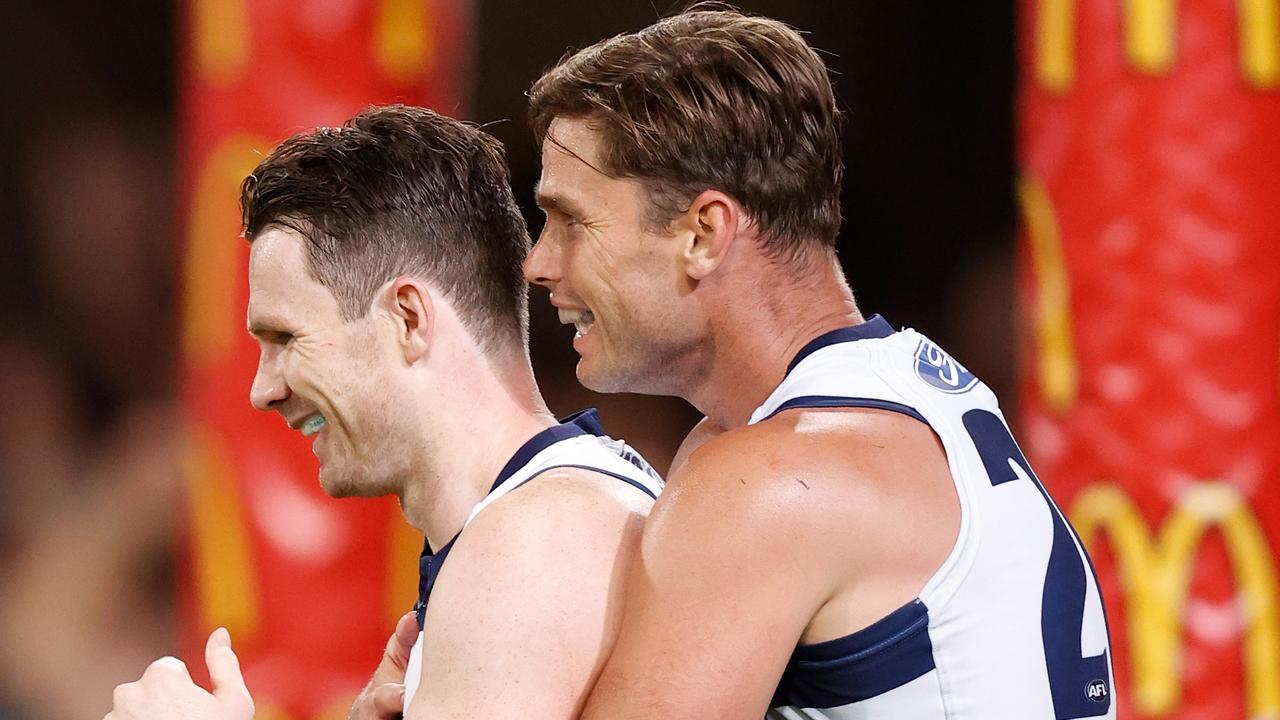 Tom Hawkins, pictured with Patrick Dangerfield, has revealed the excruciating pain he was forced to play with during the latter half of the season.