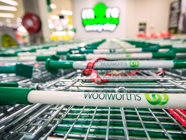 The logo of Woolworths Ltd.'s Woolworths chain of supermarkets is displayed on shopping trolleys in Sydney, Australia, on Tuesday, Aug. 27, 2013. Woolworths Ltd., Australia's largest retailer, is scheduled to report full-year results on Aug. 28. Photographer: Ian Waldie/Bloomberg