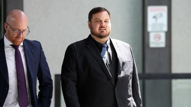 Thomas Matthew Bevitt (right) leaving Brisbane Magistrates Court with his defence lawyer Kris Jahnke. Picture: Liam Kidston