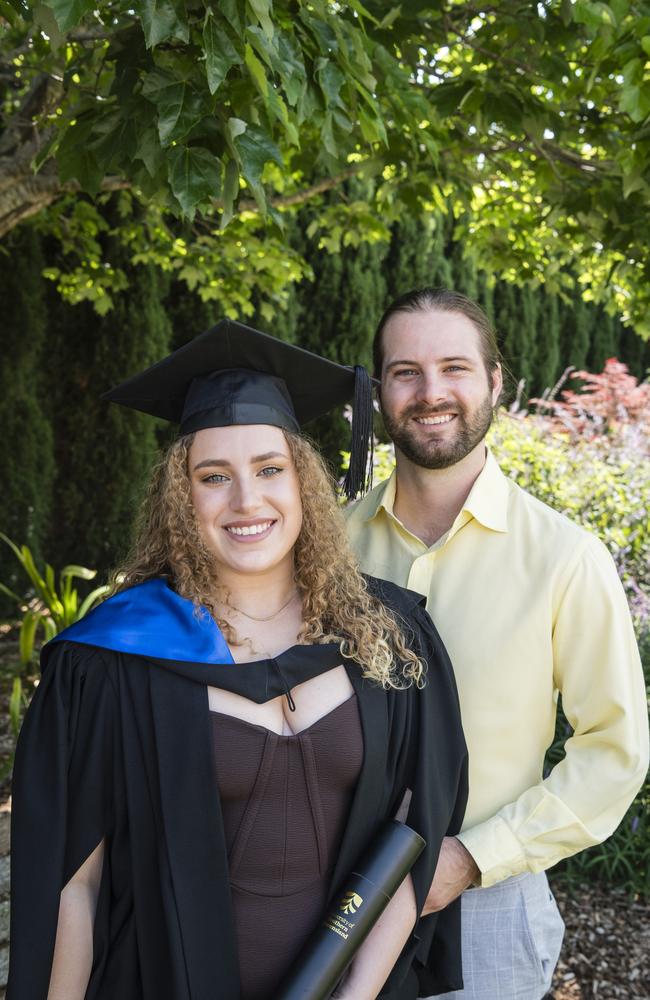 Lauren Staines celebrates completing her post graduate diploma of counselling with Chris Fisher at a UniSQ graduation ceremony at Empire Theatres, Tuesday, October 31, 2023. Picture: Kevin Farmer