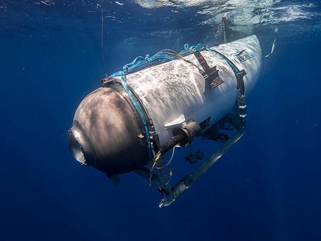 This undated image courtesy of OceanGate Expeditions, shows their Titan submersible beginning a descent. Rescue teams expanded their search underwater on June 20, 2023, as they raced against time to find a Titan deep-diving tourist submersible that went missing near the wreck of the Titanic with five people on board and limited oxygen. All communication was lost with the 21-foot (6.5-meter) Titan craft during a descent June 18 to the Titanic, which sits at a depth of crushing pressure more than two miles (nearly four kilometers) below the surface of the North Atlantic. (Photo by Handout / OceanGate Expeditions / AFP) / RESTRICTED TO EDITORIAL USE - MANDATORY CREDIT "AFP PHOTO / OceanGate Expeditions" - NO MARKETING NO ADVERTISING CAMPAIGNS - DISTRIBUTED AS A SERVICE TO CLIENTS