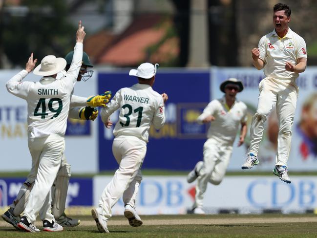 Mitchell Swepson of Australia celebrates with his teammates after dismissing Dinesh Chandimal of Sri Lanka. Picture: Buddhika Weerasinghe/Getty Images