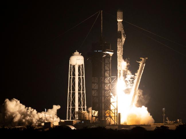 This NASA handout image shows a SpaceX Falcon 9 rocket launching with NASA's Imaging X-ray Polarimetry Explorer (IXPE) spacecraft onboard from Launch Complex 39A, December 9, 2021, at NASA's Kennedy Space Center in Florida. - The IXPE spacecraft is the first satellite dedicated to measuring the polarization of X-rays from a variety of cosmic sources, such as black holes and neutron stars. Launch occurred at 1:00 a.m. EST. (Photo by Joel KOWSKY / NASA / AFP) / RESTRICTED TO EDITORIAL USE - MANDATORY CREDIT "AFP PHOTO / NASA / JOEL KOWSKY " - NO MARKETING - NO ADVERTISING CAMPAIGNS - DISTRIBUTED AS A SERVICE TO CLIENTS