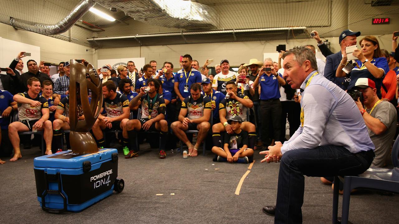 Paul Green talks to his players in the Cowboys changeroom after winning the 2015 NRL Grand Final. Picture: Getty Images