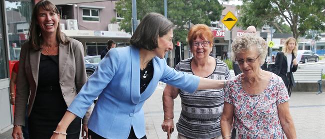 Premier Gladys Berejiklian chats to locals during a walk through Revesby on Friday. Liberal candidate Wendy Lindsay is at left. Picture: Richard Dobson