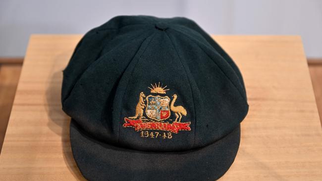 A cap worn by Australia's greatest cricket legend Don Bradman on display at an auction house Bonhams in Sydney. (Photo by Saeed Khan/ AFP)