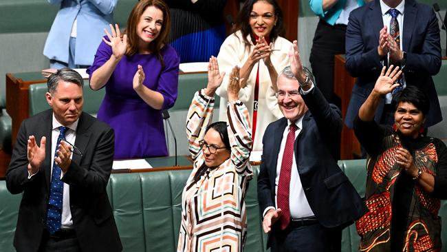 Minister for Indigenous Australians Linda Burney and Australian Attorney-General Mark Dreyfus react after the introduction of the bill to establish an Aboriginal and Torres Strait Islander Voice.