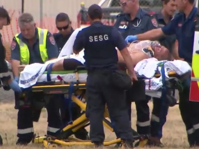 Tony Mokbel being worked on by paramedics at Barwon prison Lara after being stabbed sometime today. Picture: Nine News