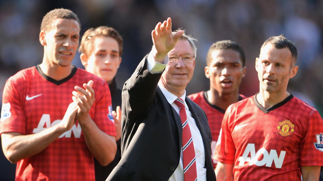 Manchester United manager Sir Alex Ferguson is applauded by players Rio Ferdinand and Ryan Giggs after his 1,500th and final match in charge of the club.