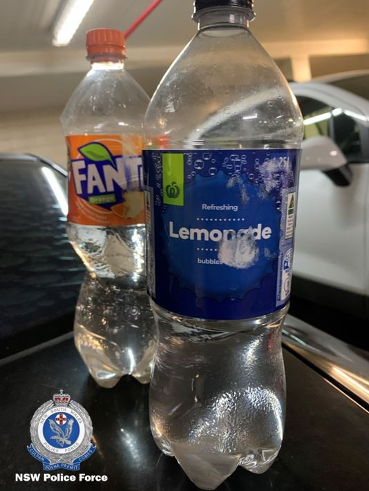 Police have released photographs of what appears to be Fanta and Lemonade bottles filled with a clear liquid which police allege to be GBL. Picture: NSW Police