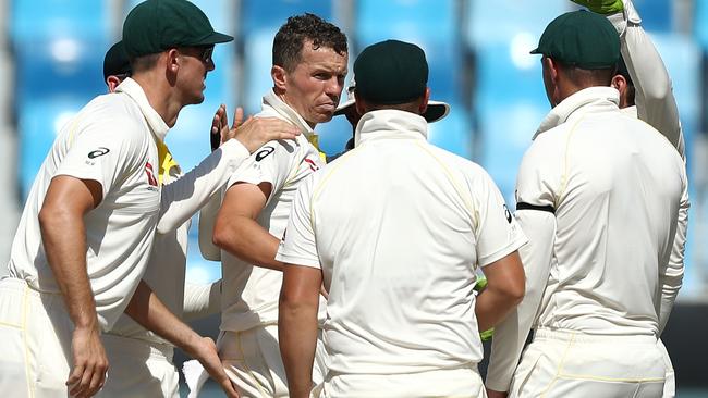 Peter Siddle celebrates with teammates. Picture: Getty Images