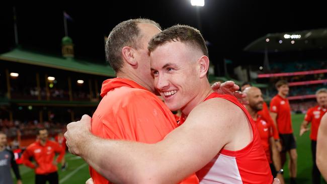 Happy times: Chad Warner embraces former coach John Longmire. Picture: Getty Images