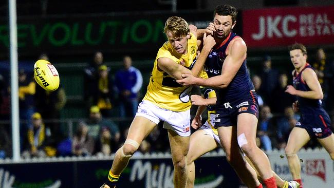 Eagles’ Jack Lukosius and Norwood's Alex Georgiou fight for possession. Picture: Bianca De Marchi