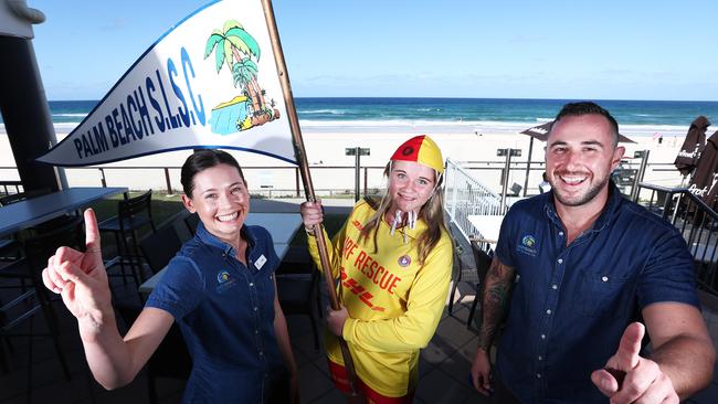 Palm Beach SLSC employees Emily Signorini, Samantha Jennings and Andrew Mihalka celebrate being voted the Coast's best surf club. Picture: Jason O'Brien.