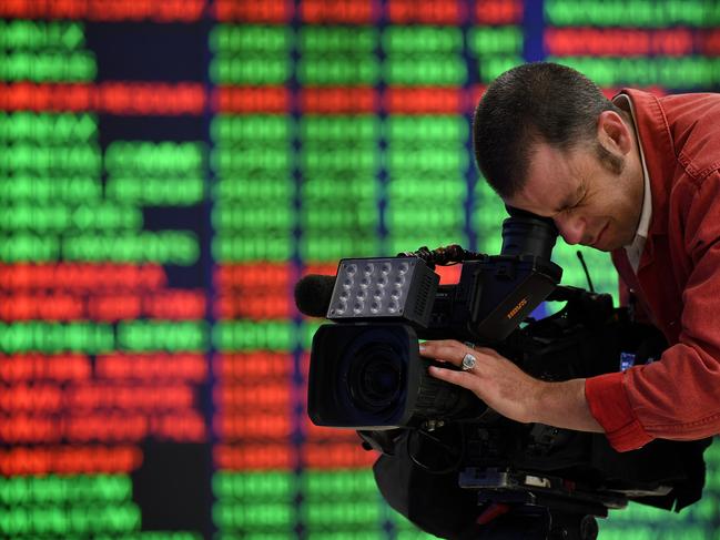 SYDNEY, AUSTRALIA - NCA NewsWire Photos SEPTEMBER, 03, 2020: A news camera operator films digital market boards at the Australian Stock Exchange (ASX) in Sydney. Picture: NCA NewsWire/Joel Carrett